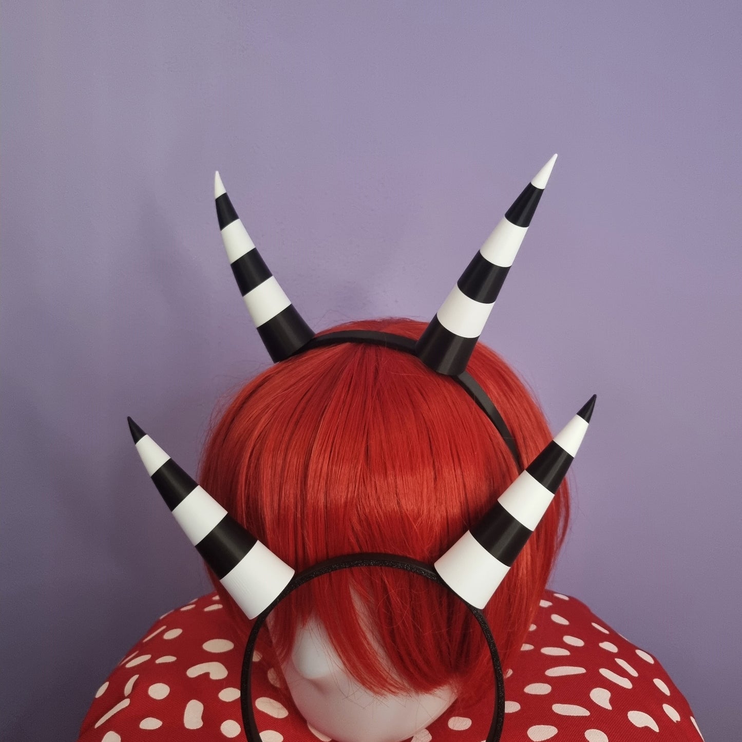 Pair of backwards imp horns (black & white stripes)