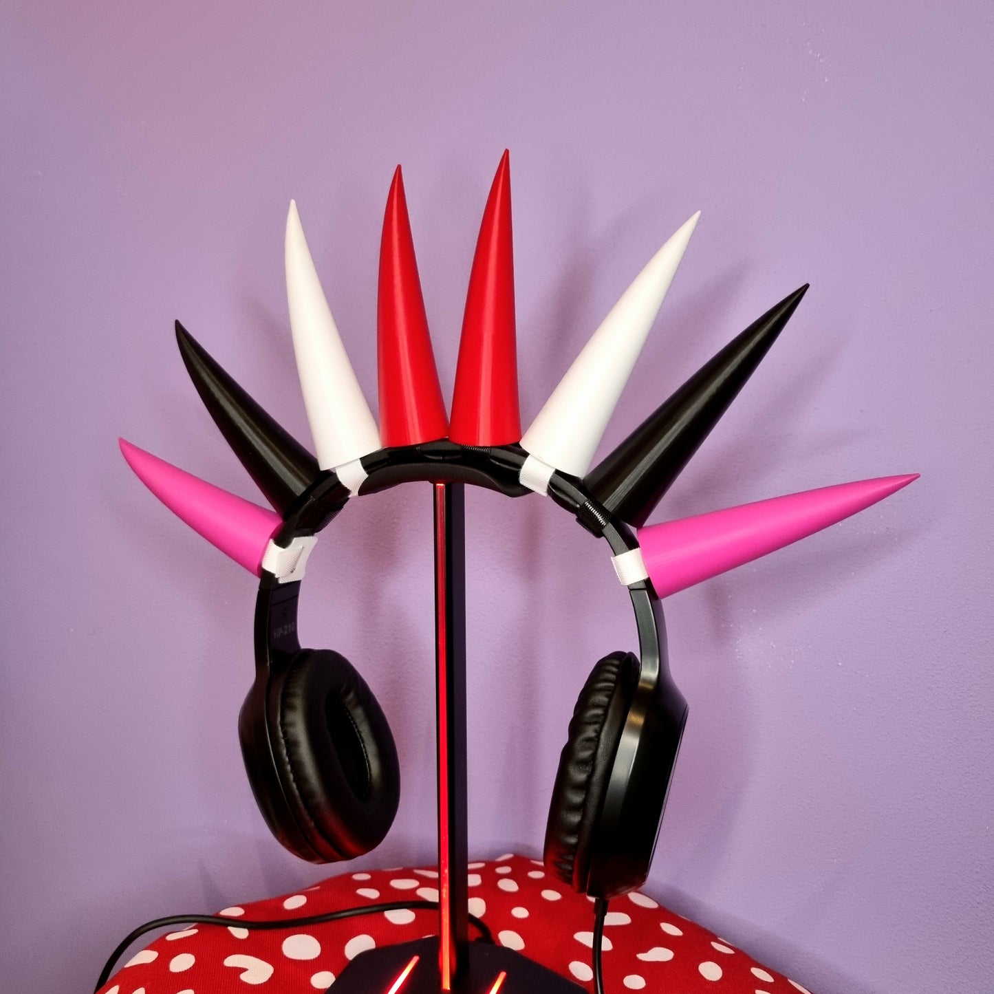 Horns for headset of red, white, black and pink colors. They are attached to the headset with velcro strips