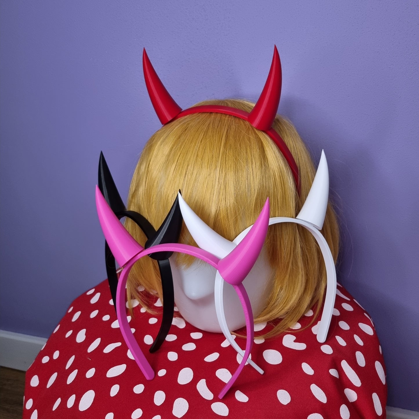 Devil cow horns for cosplay of characters such as Toriel from Undertale or Start Butterfly from Star vs Forces of evil. These horns are of red, pink, black and white colors and come with a headband.