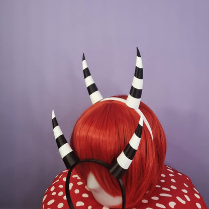 Pair of inwards imp horns (black & white stripes)