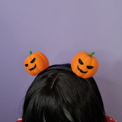 Pair of halloween pumpkins on headband