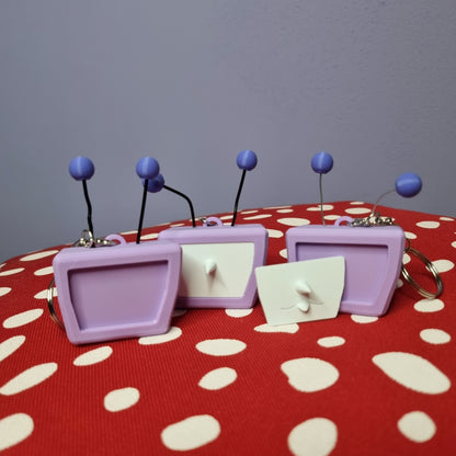 Tenna inspired keychain with swappable face