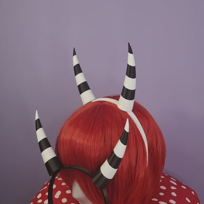 Pair of inwards imp horns (black & white stripes)